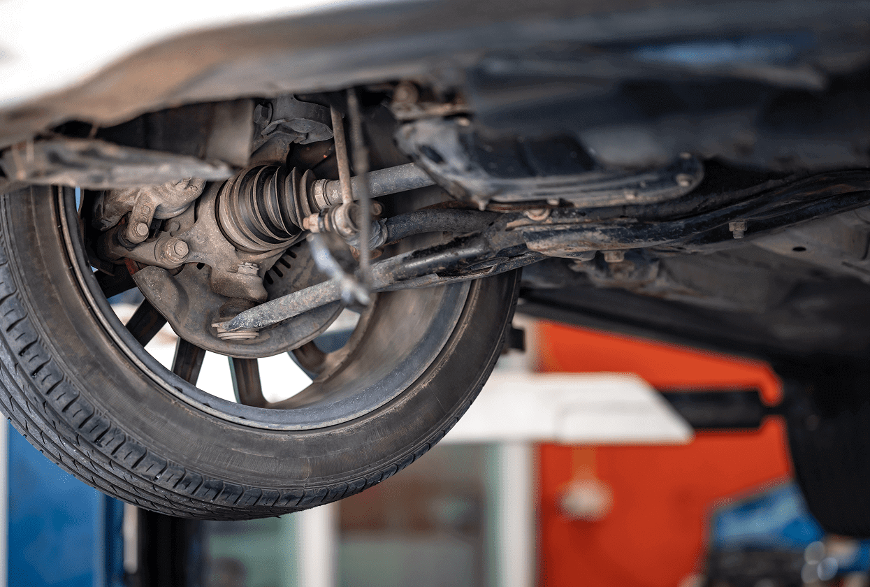 Car wheel and suspension system underside view.