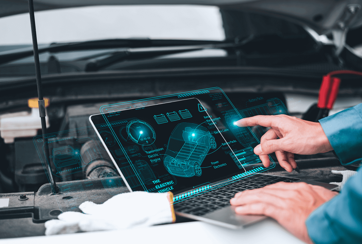 Mechanic using digital tablet for car diagnostics.