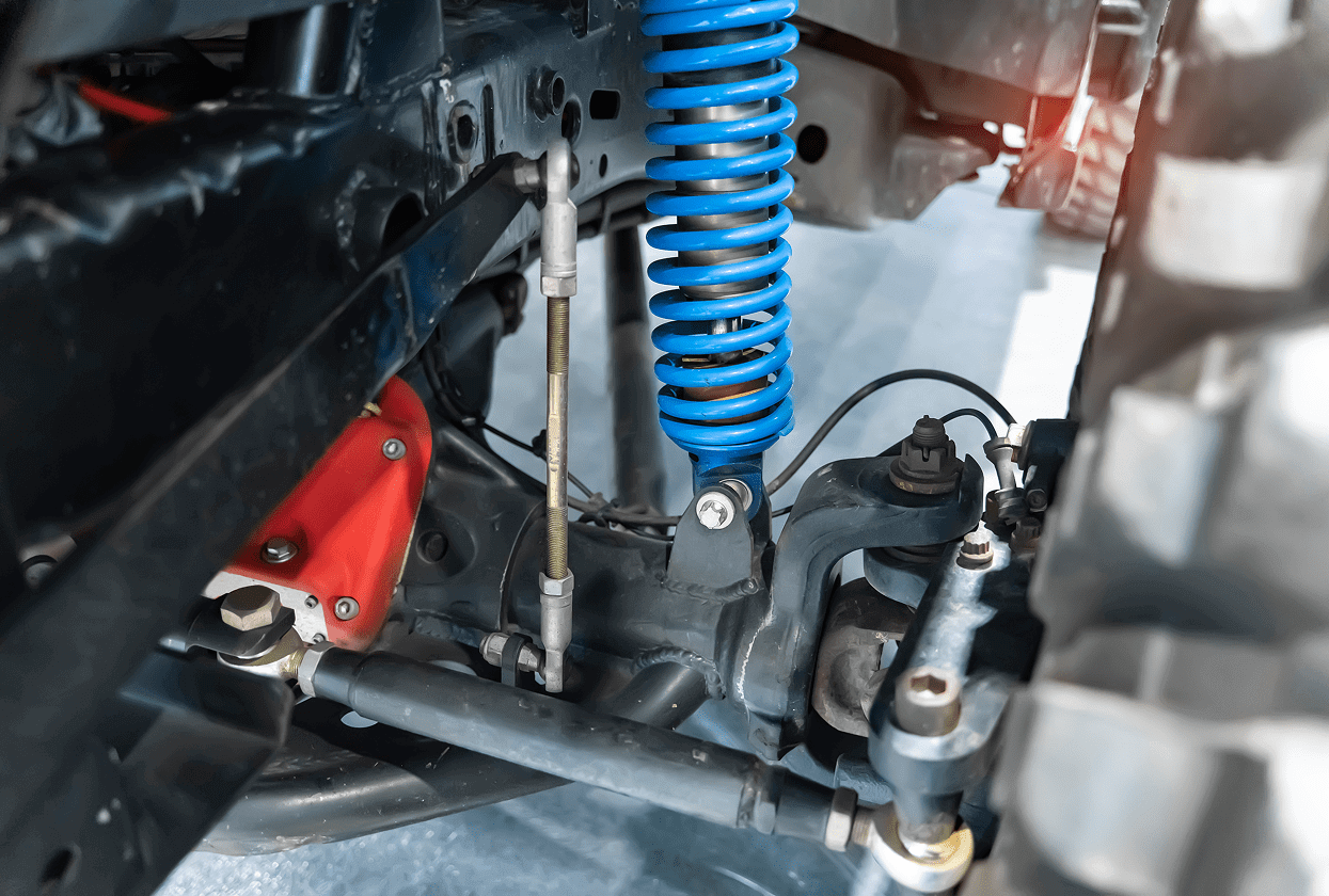 Vehicle suspension system with blue coil spring.