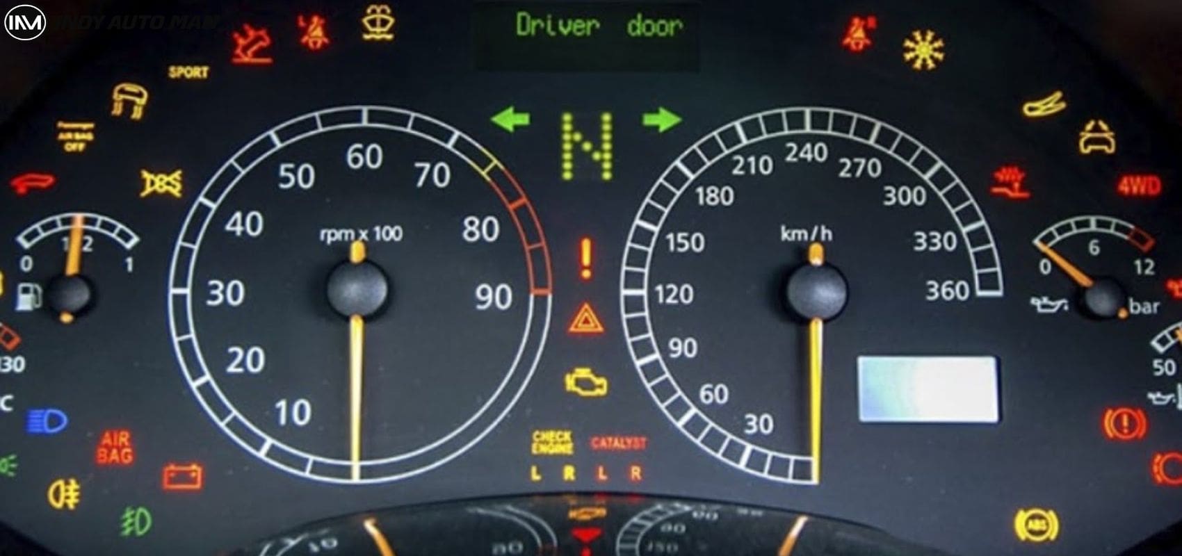 Car dashboard showing various warning lights and indicators.