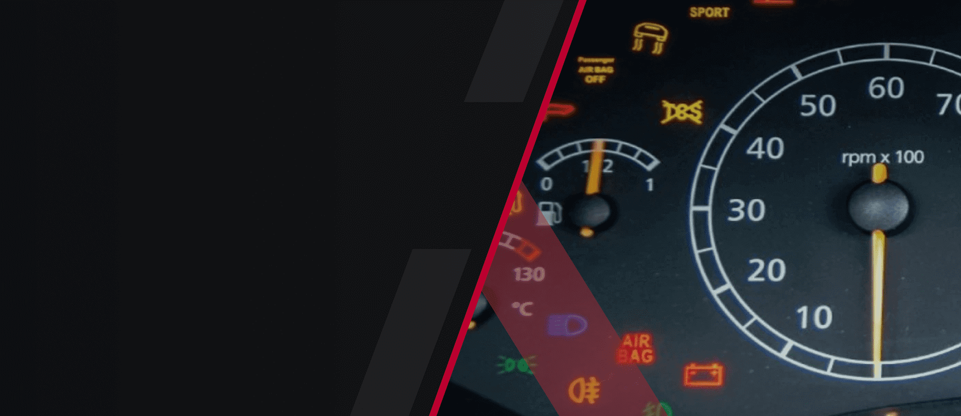 Car dashboard with illuminated warning lights and gauges.